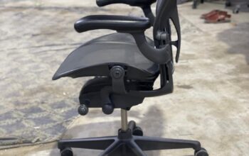 An office chair is a specially designed piece of furniture that provides support and comfort for individuals working at desks or in office settings.