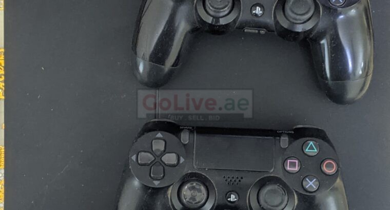 PS4 with two controllers 8 games 1 paid and free HDMI cable and power cable