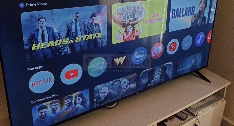 TCL 65-Inch LCD TV with Table – Excellent Condition